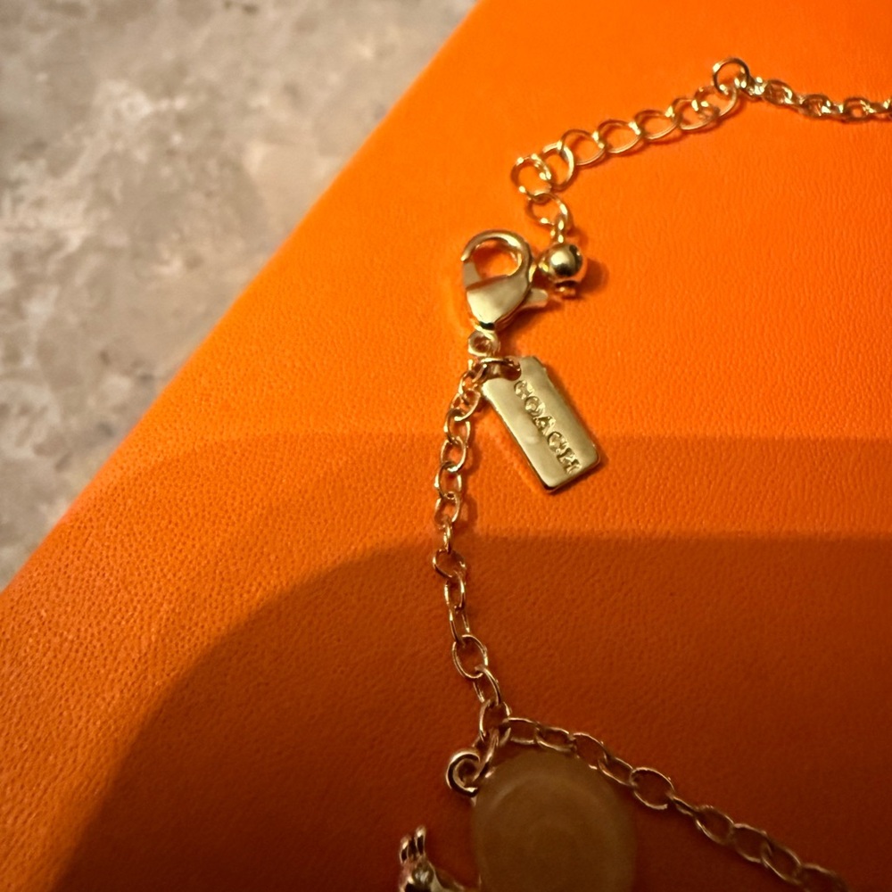 Coach Gold creature multi Charm Bracelet with Amber Heart & White Cat Charm - Picture 7 of 10